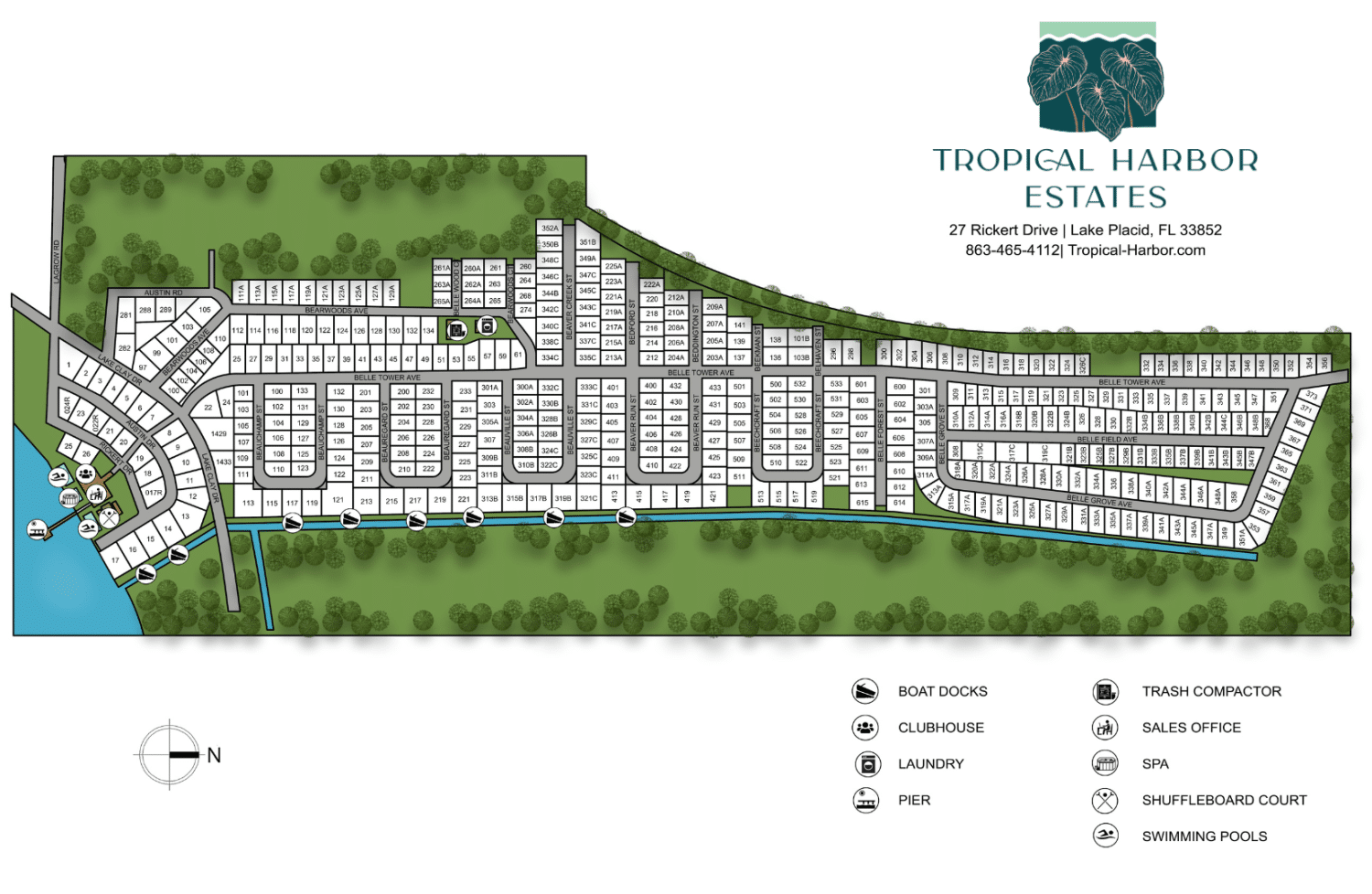 Site map of Tropical Harbor Estates showing roads, residential plots, amenities such as pools, clubhouse, shuffleboard court, boat docks, and a legend with facility icons and contact information.
